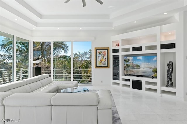 living area featuring recessed lighting, marble finish floor, built in shelves, and ceiling fan