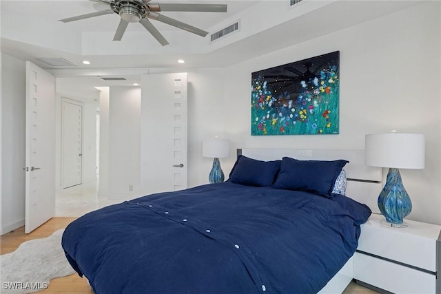 bedroom featuring recessed lighting, wood finished floors, and visible vents