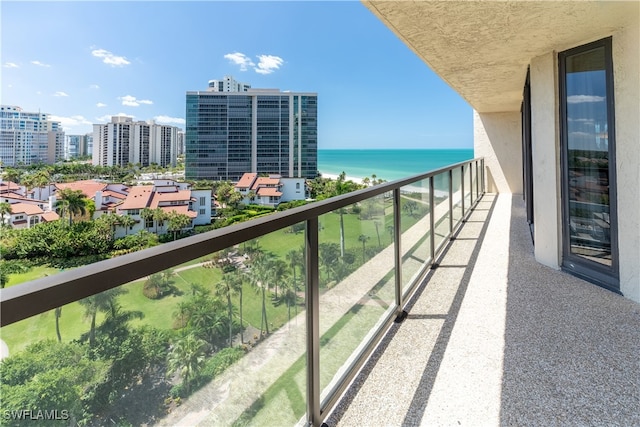 balcony with a view of city and a water view