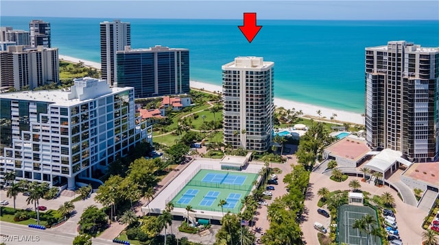 aerial view with a water view, a city view, and a view of the beach