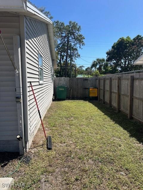 view of yard with a fenced backyard