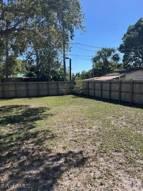 view of yard with a fenced backyard