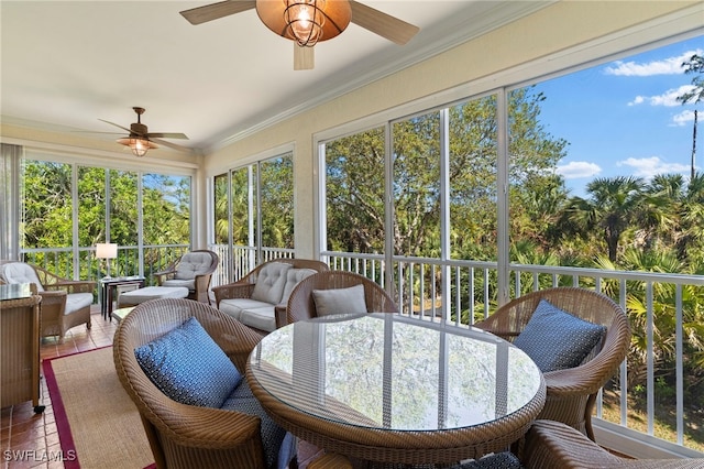 sunroom / solarium featuring ceiling fan