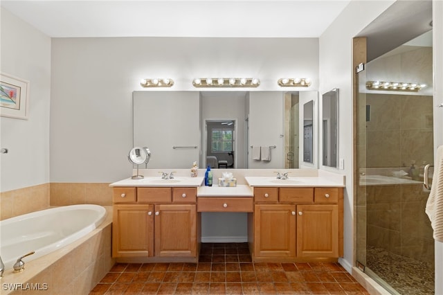 bathroom featuring a sink, double vanity, a bath, and a shower stall