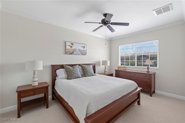 bedroom featuring a ceiling fan, visible vents, baseboards, crown molding, and light colored carpet