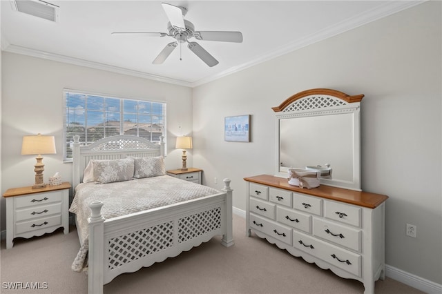 bedroom featuring crown molding, baseboards, visible vents, and light carpet