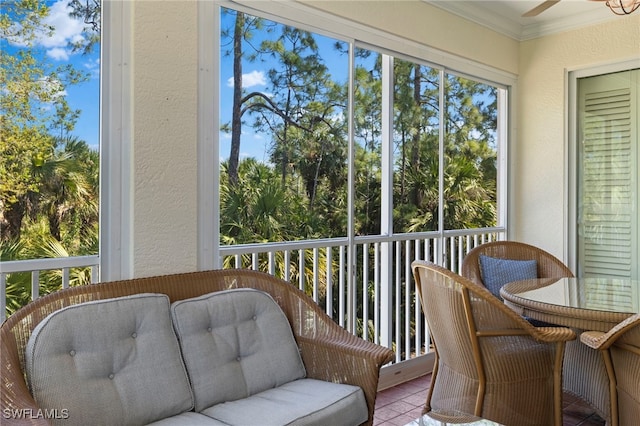 sunroom with a ceiling fan