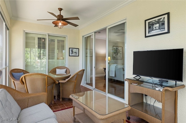 interior space featuring a ceiling fan and ornamental molding