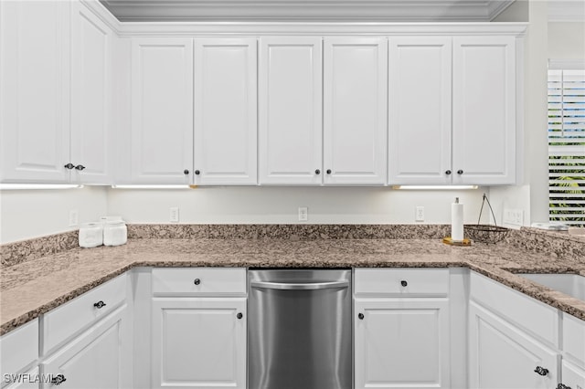 kitchen with stone counters and white cabinetry