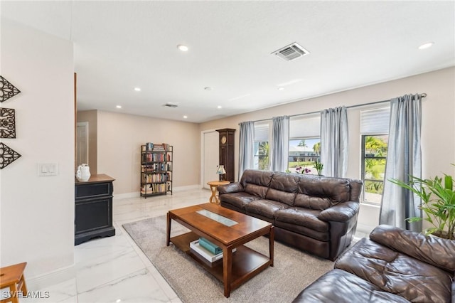 living room featuring recessed lighting, visible vents, baseboards, and marble finish floor