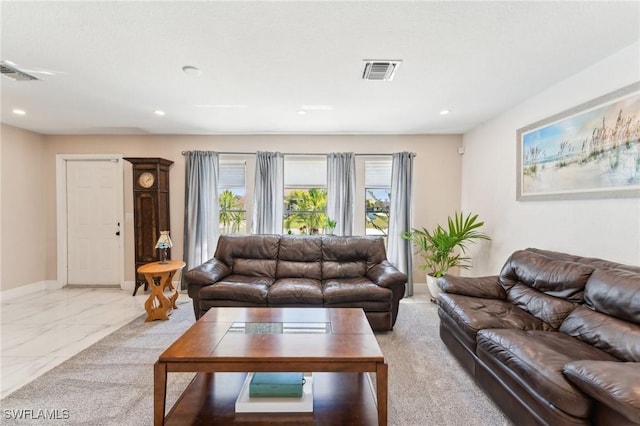 living area featuring recessed lighting, visible vents, baseboards, and marble finish floor