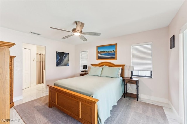 bedroom featuring visible vents, baseboards, marble finish floor, and a ceiling fan