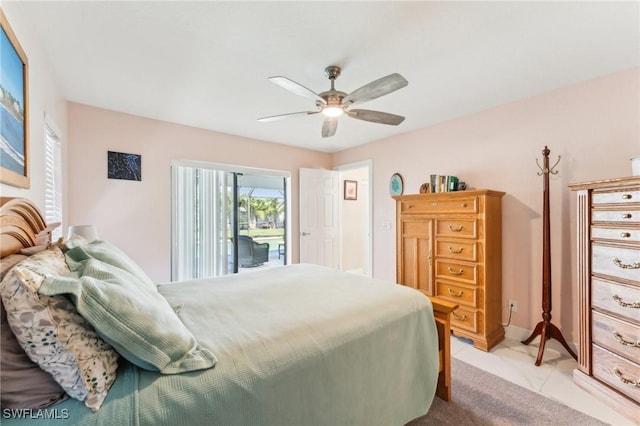 bedroom with access to outside, light tile patterned floors, and a ceiling fan