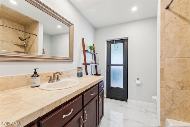 full bath featuring toilet, marble finish floor, a shower, baseboards, and vanity