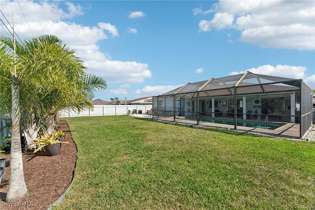 view of yard with a fenced in pool, a fenced backyard, and glass enclosure