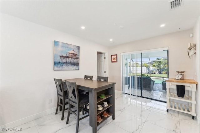 dining room featuring recessed lighting, visible vents, marble finish floor, and baseboards