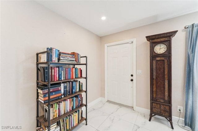 interior space with recessed lighting, baseboards, and marble finish floor