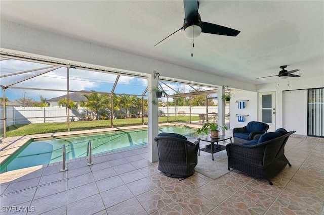 view of swimming pool with glass enclosure, a fenced backyard, and a patio area