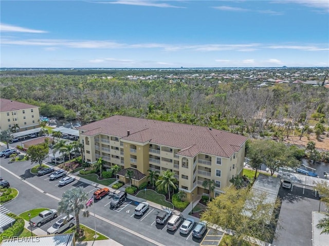 drone / aerial view featuring a view of trees