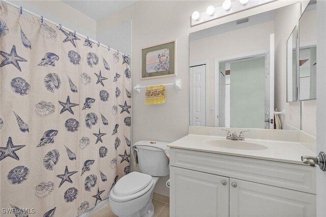 bathroom with vanity, toilet, a shower with curtain, and visible vents