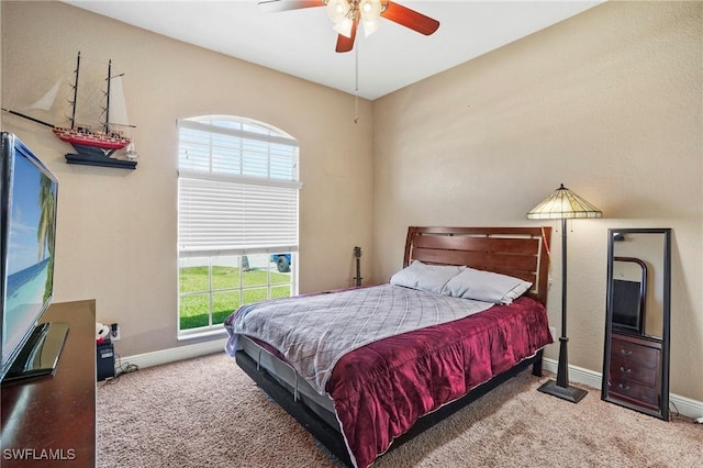 bedroom featuring multiple windows, baseboards, and carpet floors