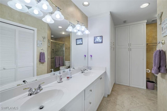 full bathroom with a closet, a shower stall, double vanity, tile patterned floors, and recessed lighting