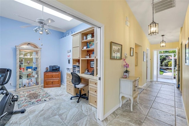 home office with a ceiling fan, visible vents, vaulted ceiling, and baseboards