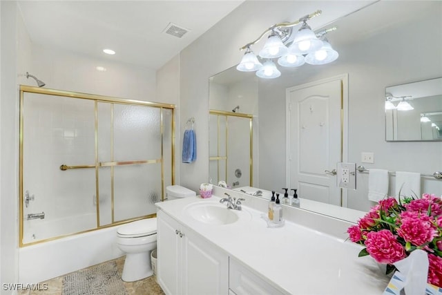 bathroom featuring toilet, shower / bath combination with glass door, vanity, and visible vents