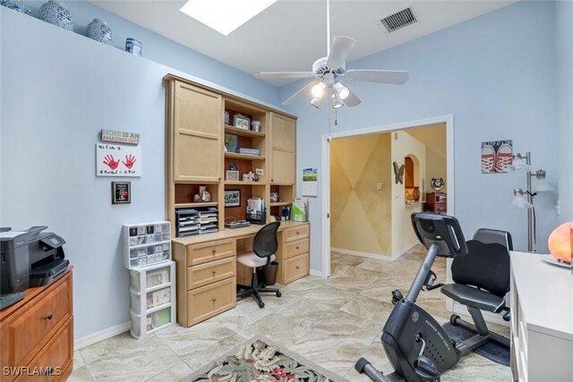 office space featuring marble finish floor, visible vents, arched walkways, and a ceiling fan