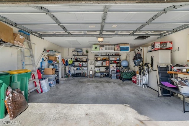 garage featuring a garage door opener