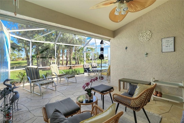 view of patio with a lanai and a ceiling fan