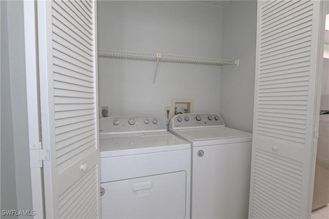 laundry room with washing machine and dryer and laundry area