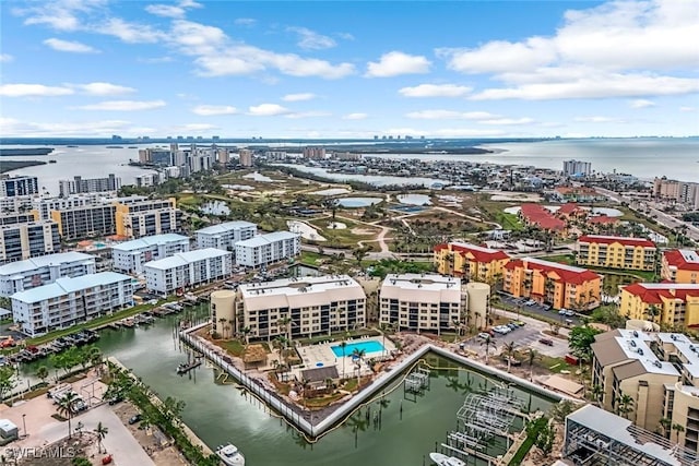 aerial view with a water view and a view of city