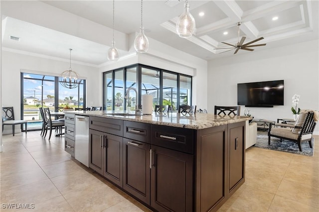 kitchen featuring light stone counters, ceiling fan with notable chandelier, a sink, visible vents, and dishwasher