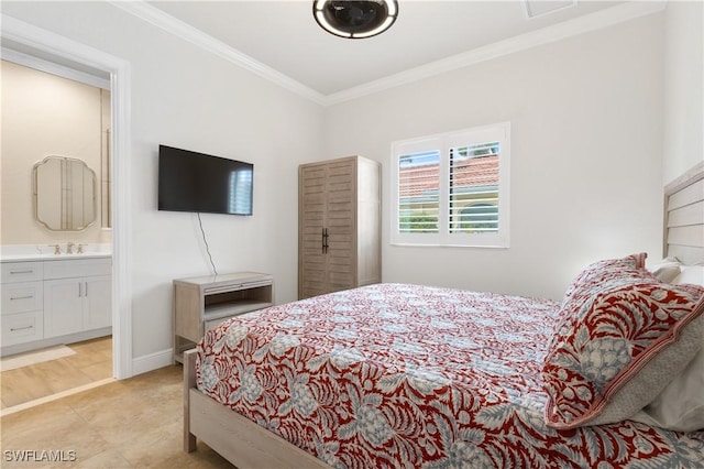 bedroom with baseboards, connected bathroom, ornamental molding, and a sink