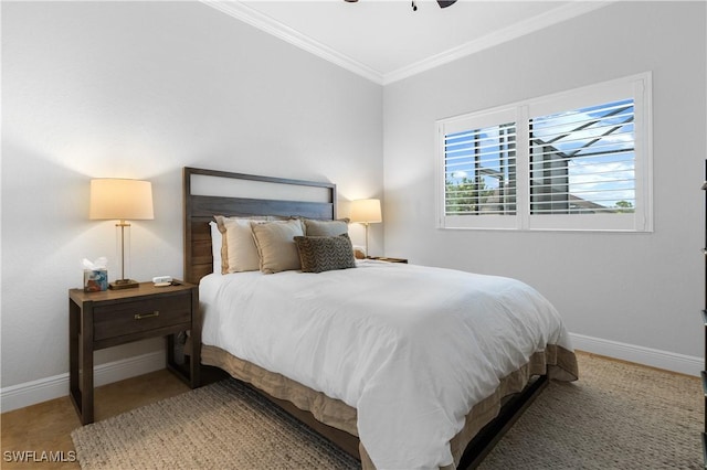 bedroom featuring ceiling fan, ornamental molding, and baseboards