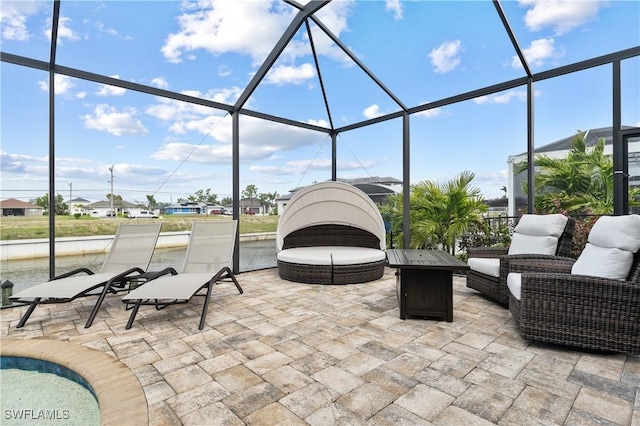 view of patio / terrace featuring glass enclosure