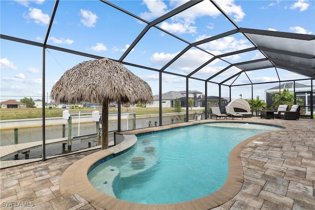 outdoor pool with a patio, a dock, boat lift, and glass enclosure