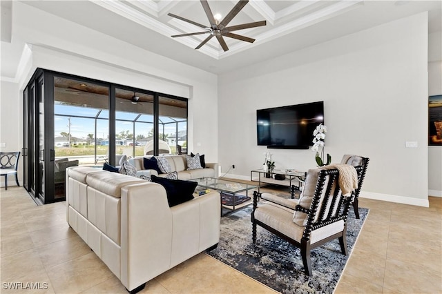 living area featuring a sunroom, coffered ceiling, ceiling fan, and baseboards