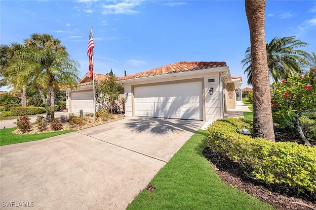 view of front of property with a garage and a tiled roof