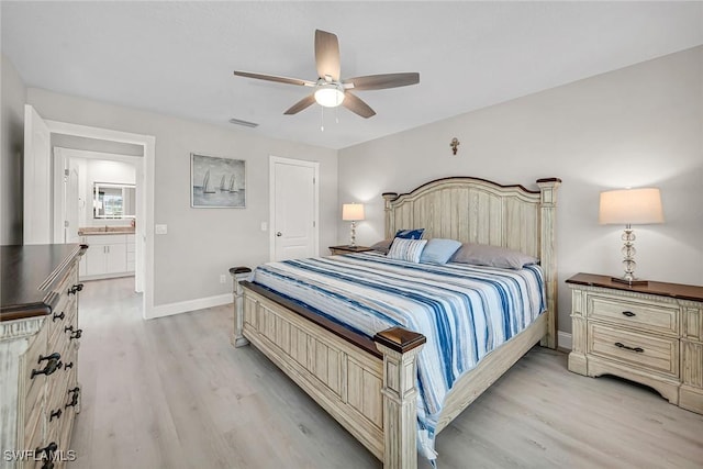 bedroom featuring a ceiling fan, visible vents, light wood-style flooring, and baseboards