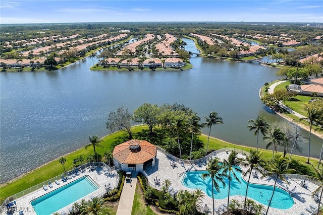 birds eye view of property with a water view