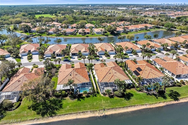 aerial view with a water view and a residential view