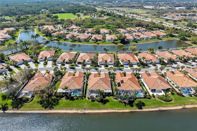 aerial view with a water view and a residential view