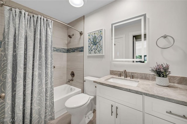 full bath featuring toilet, vanity, and shower / bathtub combination with curtain