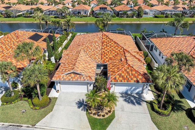 bird's eye view featuring a residential view and a water view