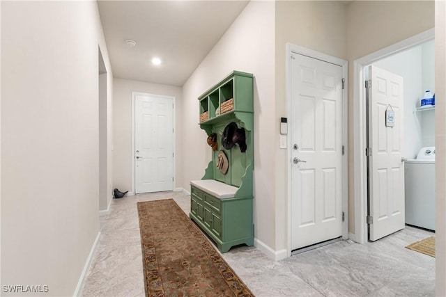 mudroom with baseboards and washer / clothes dryer