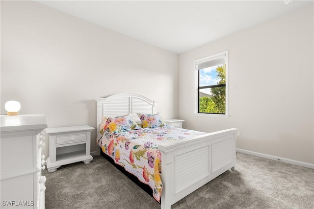 carpeted bedroom with baseboards