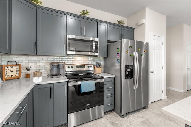 kitchen featuring appliances with stainless steel finishes and backsplash