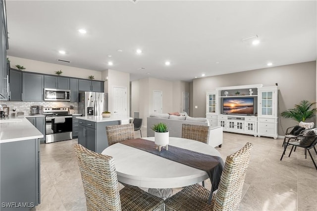 dining area with baseboards, visible vents, and recessed lighting